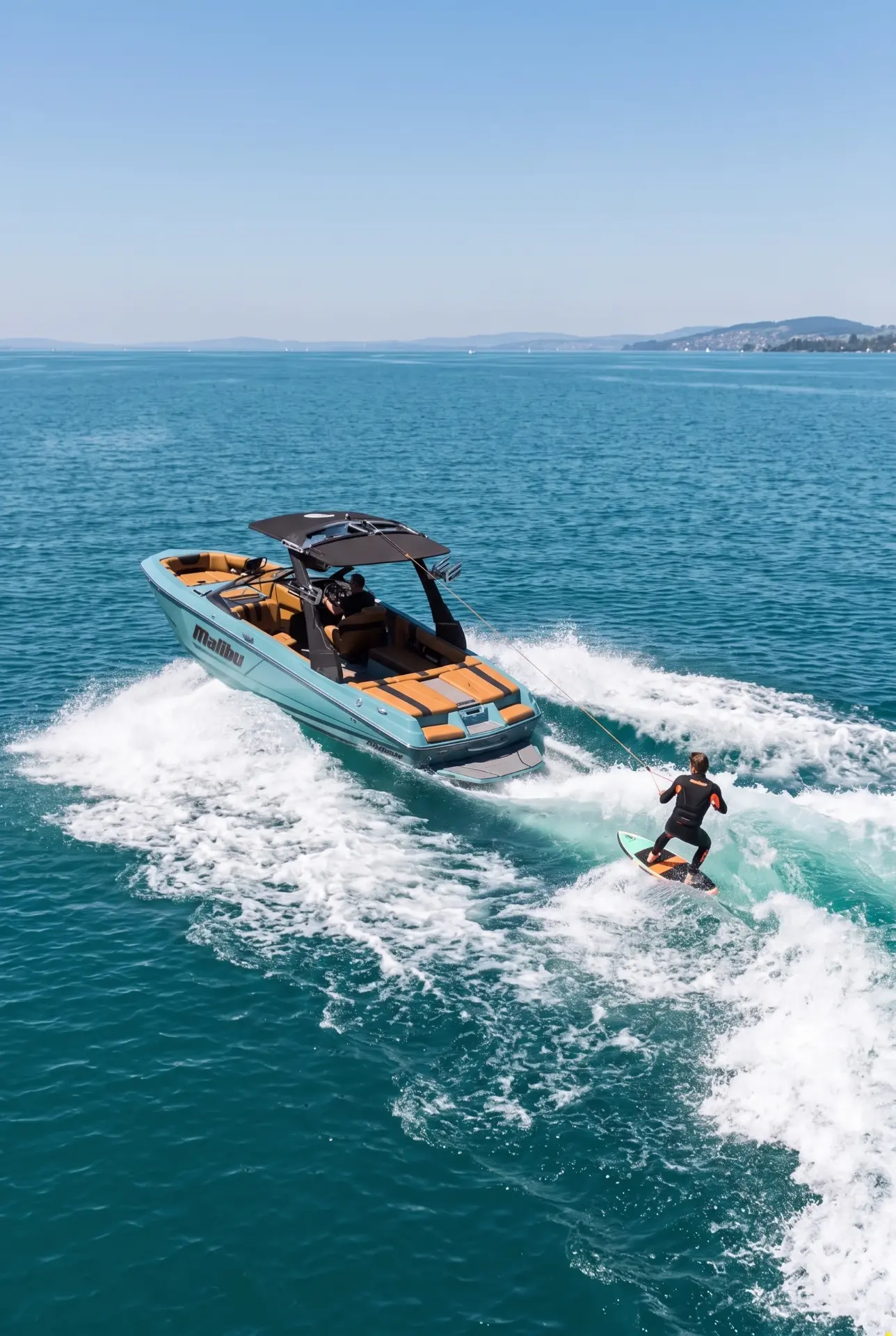 “Add me wakeboarding behind the boat on the back view picture” — P.C. from Spain